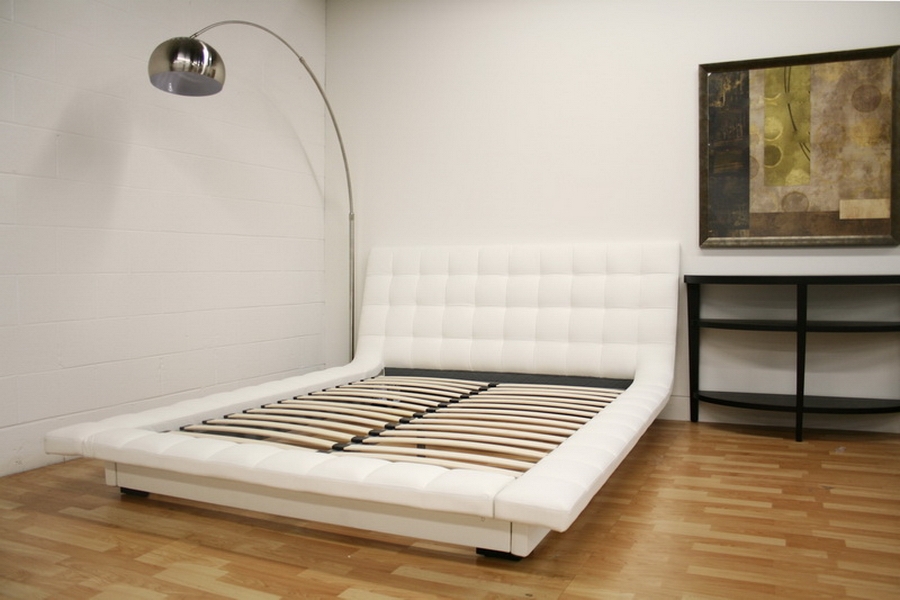 the contemporary design of this padded upholstered platform bed helps 